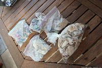 overview of five zip bags on wooden surface