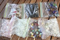 All seven bags laid out showing variety of contents