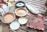 Seven saucers displayed top side up on table