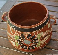 Top angled view showing handles and painted design