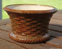 front view of glazed rope-pattern planter