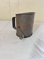 Front view showing Bromwell’s branding, crank mechanism, and handle