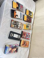 All ten VHS tapes laid out on table