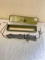 Knife in sheath with box visible