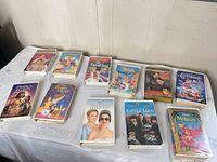 Front covers of 12 VHS tapes laid out on table