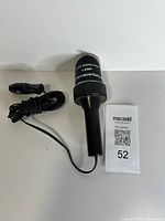 Full view of inspection lamp with cord and QR card