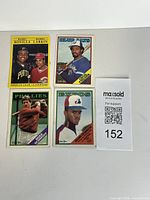 All four cards laid out, lot reference tag visible