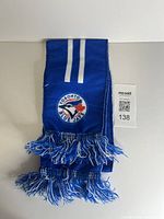 Scarf folded showing Toronto Blue Jays logo and fringes
