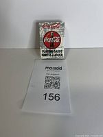 Front view of Coca-Cola mini playing cards deck