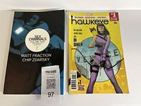 Both comic books front covers visible