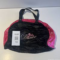 Front view showing embroidered "Dance" and overall design