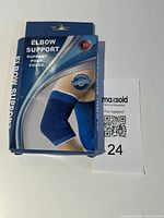 Front of retail package showing elbow support product image and branding