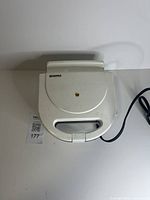 Closed Kenmore sandwich maker with cord visible