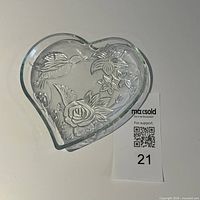 Top view of heart-shaped glass dish showing hummingbird and flowers
