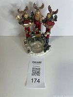 Front view of reindeer candle holder with glass cup
