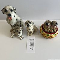 Front view of all three dog figurines
