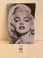 Front view of sealed Marilyn Monroe tin sign