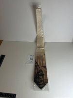 Front view of packaged tie with Brooklyn Bridge design