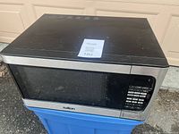Front view showing Salton microwave with window and control panel