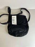 Front view showing Nike logo, zip pocket and tag