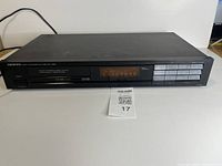 Front view of Onkyo T-4130 tuner showing display and controls