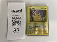 Card alongside auction tag, showing entire front, sleeve visible