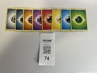 All eight energy cards fanned out