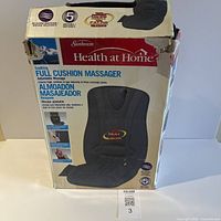 Front of retail box showing Sunbeam Health at Home full cushion massager image and specifications