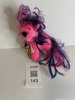 Front view of Ty Beanie Boos Ruby pony plush with tag visible