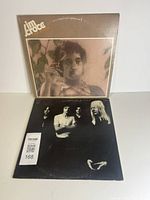 Both album covers front view