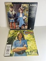 Front covers of ABBA Greatest Hits and Olivia Newton-John LPs