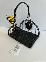 Front angled view showing basket, handle, bee ornament, lot tag