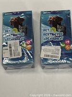 Front view of two sealed Amsau Pet Restricted Area Spray boxes