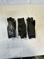 Three pairs gloves laid flat showing overall design and color