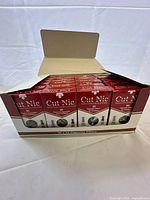 Open case showing multiple Cut Nic boxes