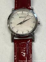 Front close-up of DKNY watch face and upper band