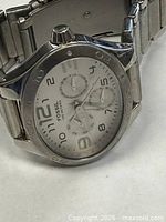 Front view of Fossil chronograph watch showing dial and bracelet