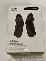 Front of retail box showing Kiwi Design G4 Pro grips image and branding