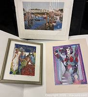 Overview showing all three signed prints with respective presentations
