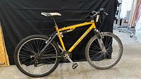 Full side view of yellow Rocky Mountain mountain bike