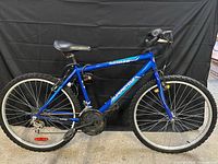 Full side view of blue Supercycle SC1800 mountain bike