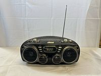 Front view showing speakers, display, antenna