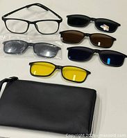 Entire set laid out: frame, five lenses, case