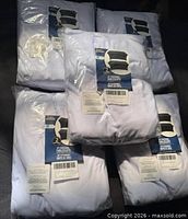 Five sealed packages of Utopia Kitchen 2-pack 6ft white stretch tablecloths