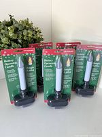 Front view of five packaged LED candles