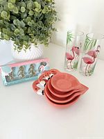 Entire lot showing tumblers, stacked ceramic bowls, boxed paper clips