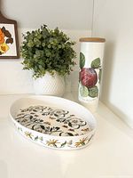 Both items side by side: baking dish front, storage jar with lid in background