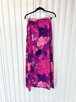Full view of long floral wrap skirt on hanger