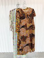All four dresses hanging together front view