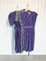 All four dresses hanging side by side